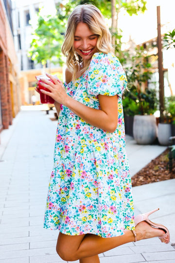 ASYMMETRIC NECK LINE TIERED FLORAL BABYDOLL DRESS