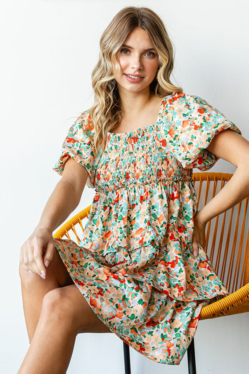 APRICOT FLORAL PRINT TIERED DRESS FEATURING SMOCKED CHEST